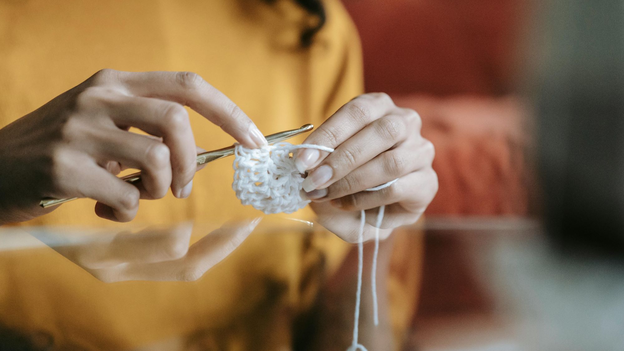 Woman working on a crocheting project