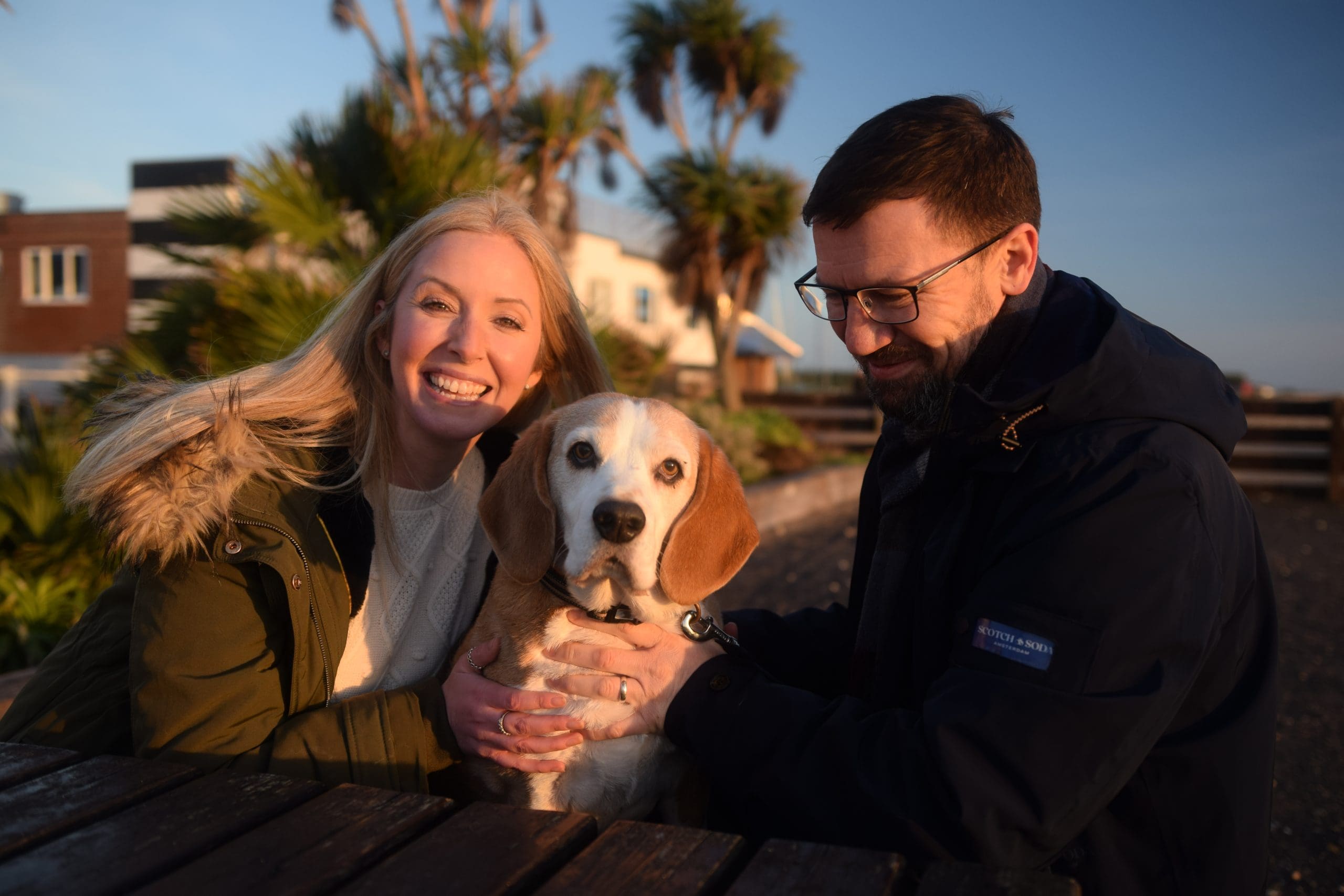 Couple on Stokes Bay with dog at pub